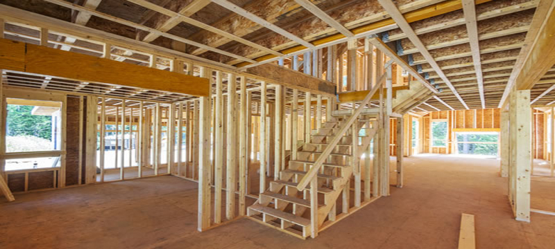 Open-concept interior framing with staircase for home addition by Hillstar Construction