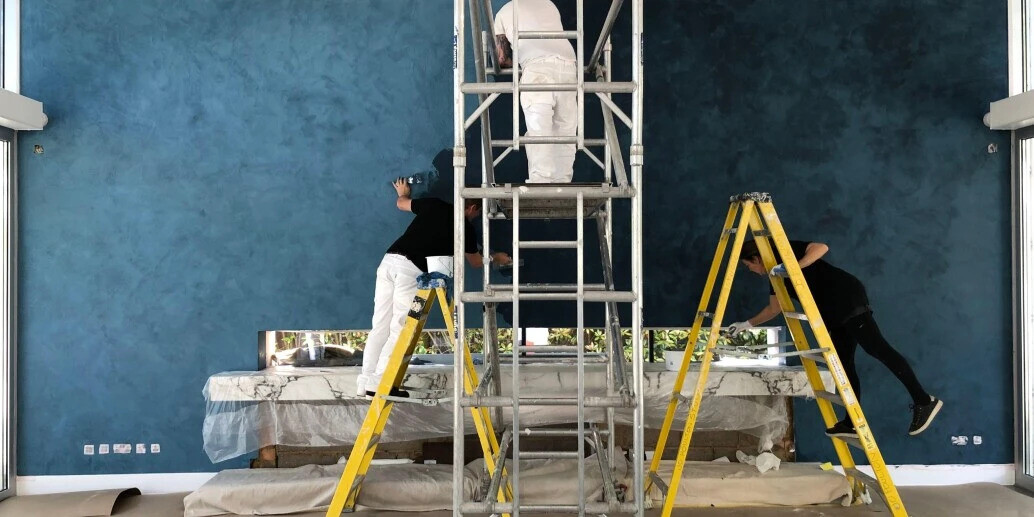 Professional painters applying interior paint finish in Los Angeles