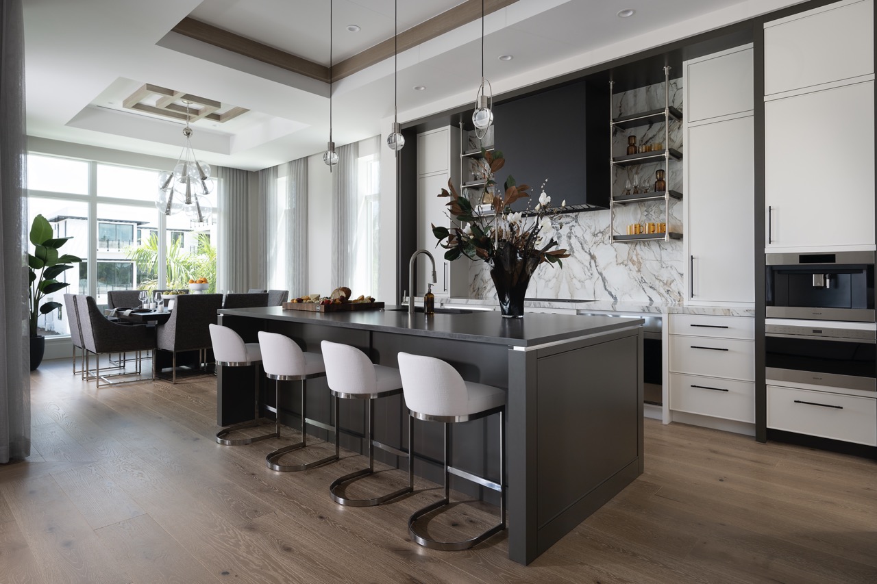 Elegant kitchen remodel with marble backsplash and island by Hillstar Construction in Los Angeles